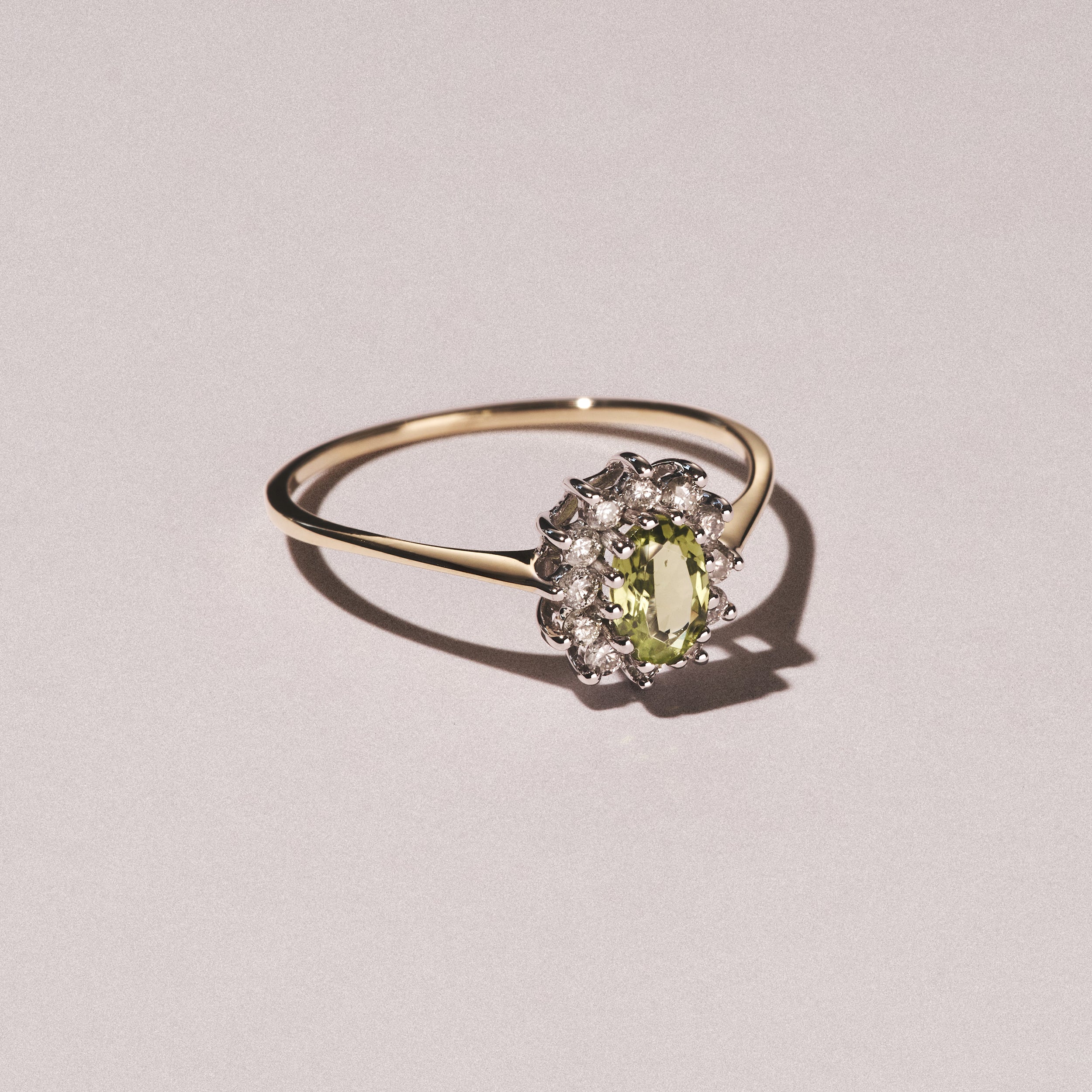 Peridot 5 x 3mm And Diamond 9K Yellow Gold Ring